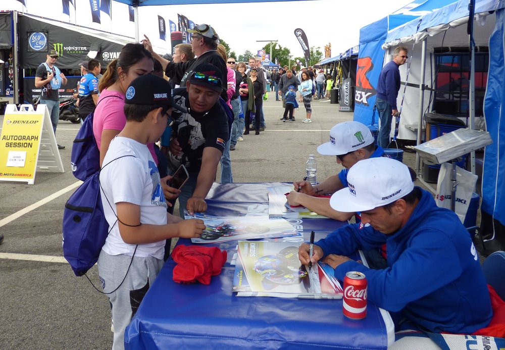 signing autographs