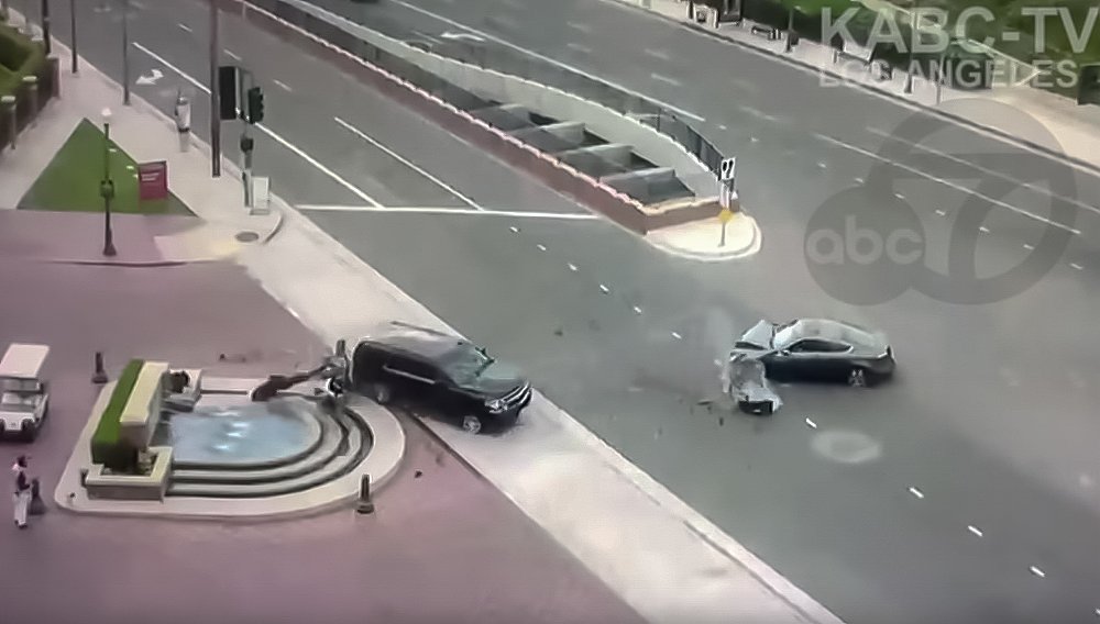 Video: Collision launches motorcycle cop into fountain