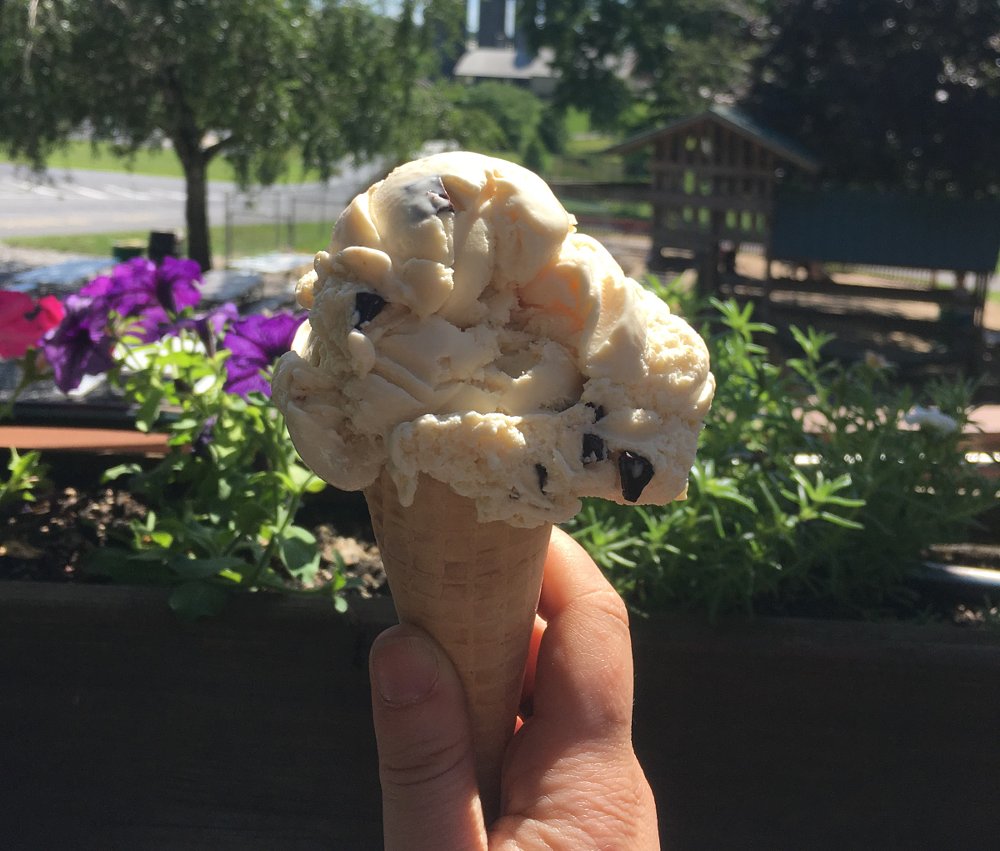 huge single scoop of ice cream on a cone