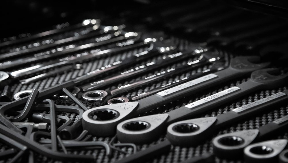 Why things are the way they are: The anatomy of the combination wrench