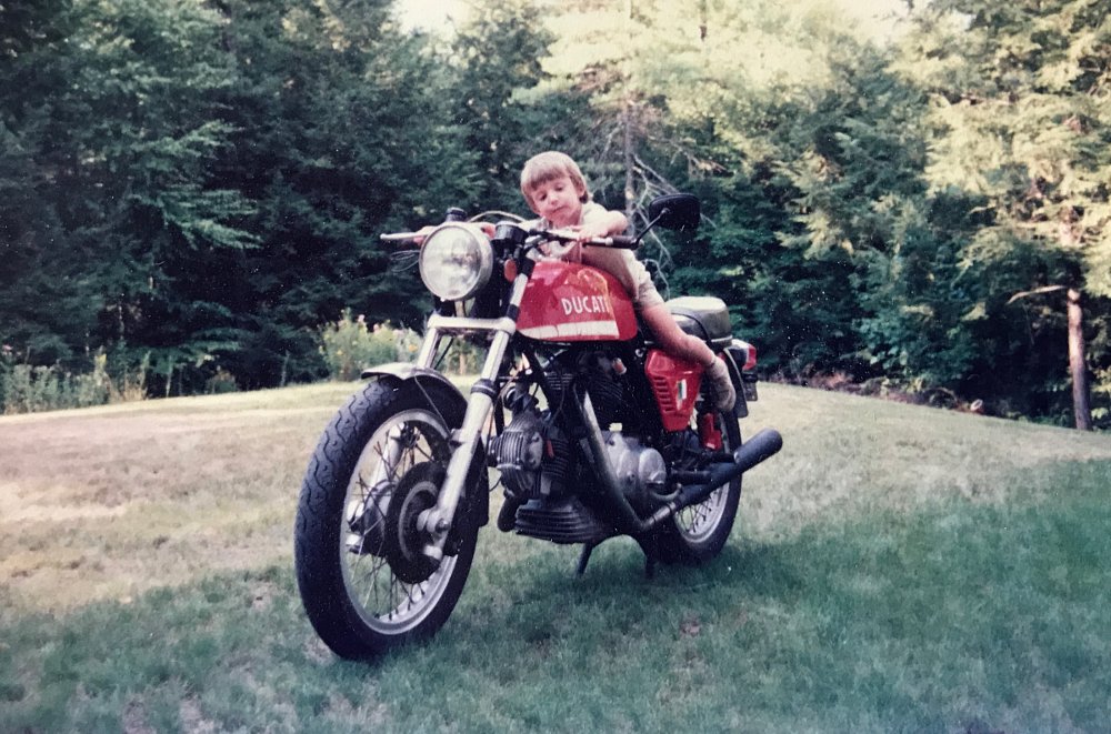 Zack as a child on a Ducati