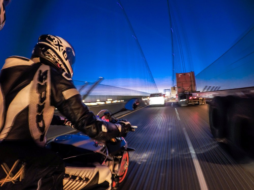 motorcycle in traffic at night