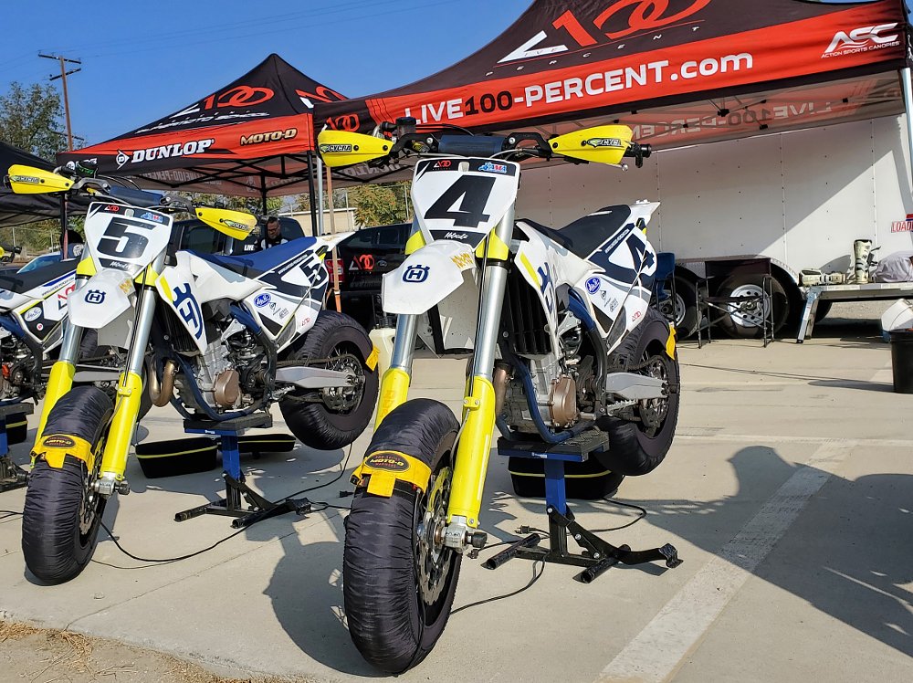 Husqvarna FS 450 race bikes in the paddock