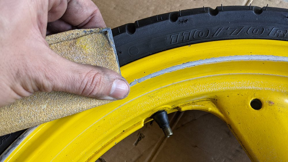 Sanding motorcycle wheel