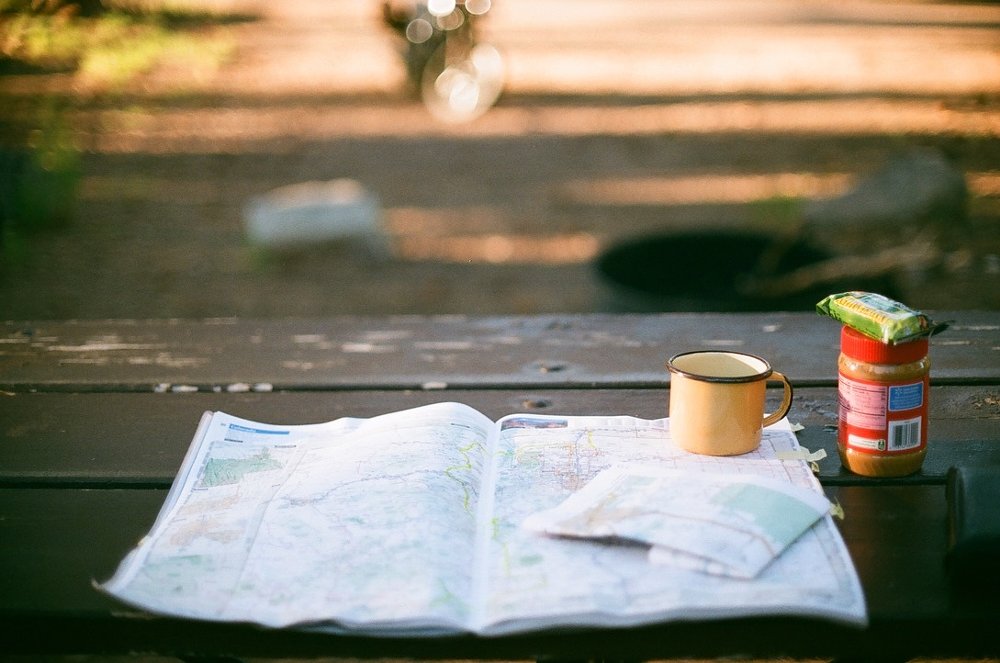 planning a route on a paper road atlas