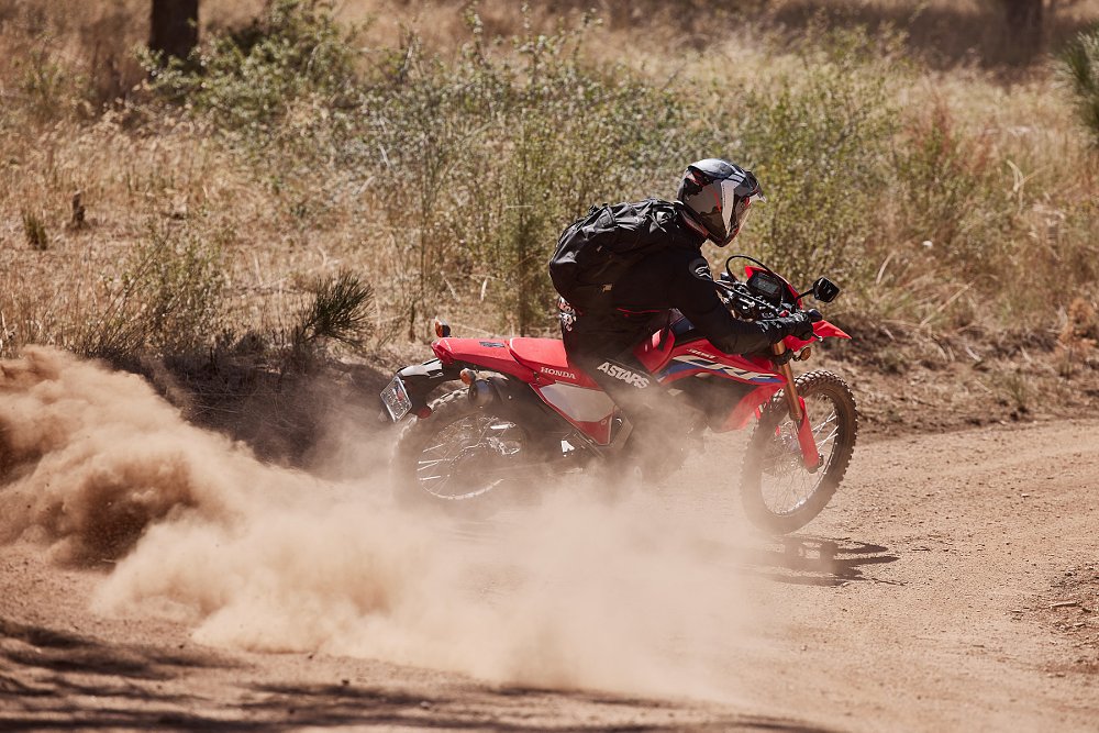 Honda CRF300L climbing a dirt trail