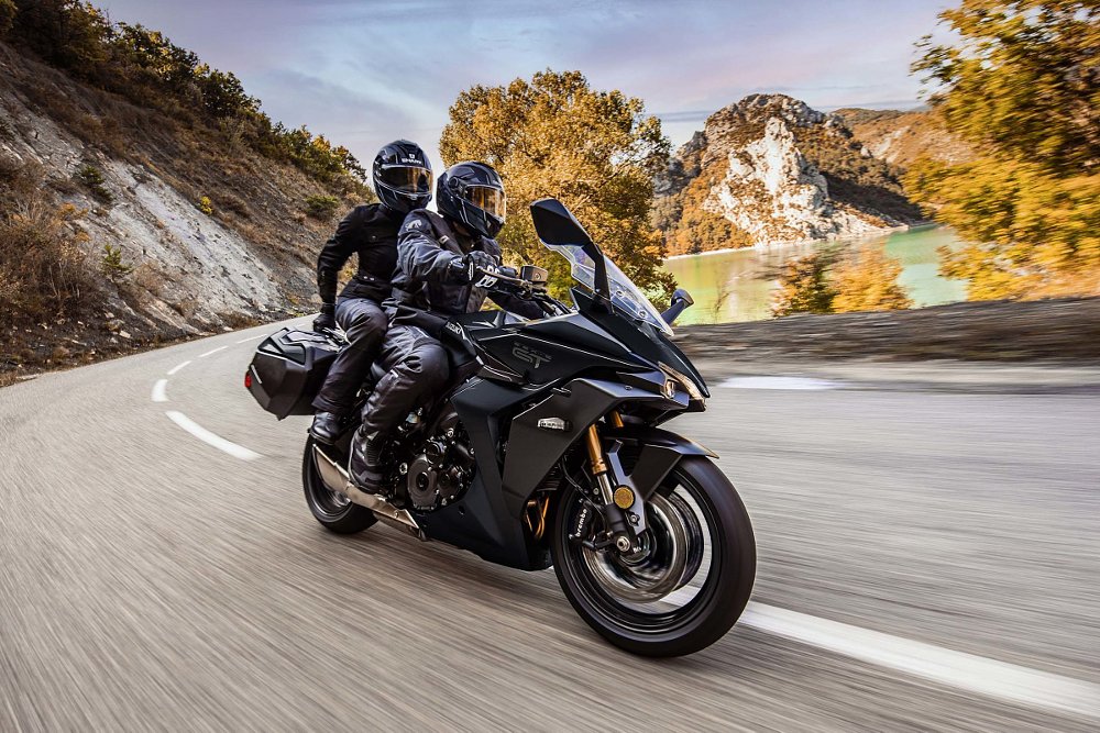 Suzuki GSX-S1000GT+ on the road with a passenger