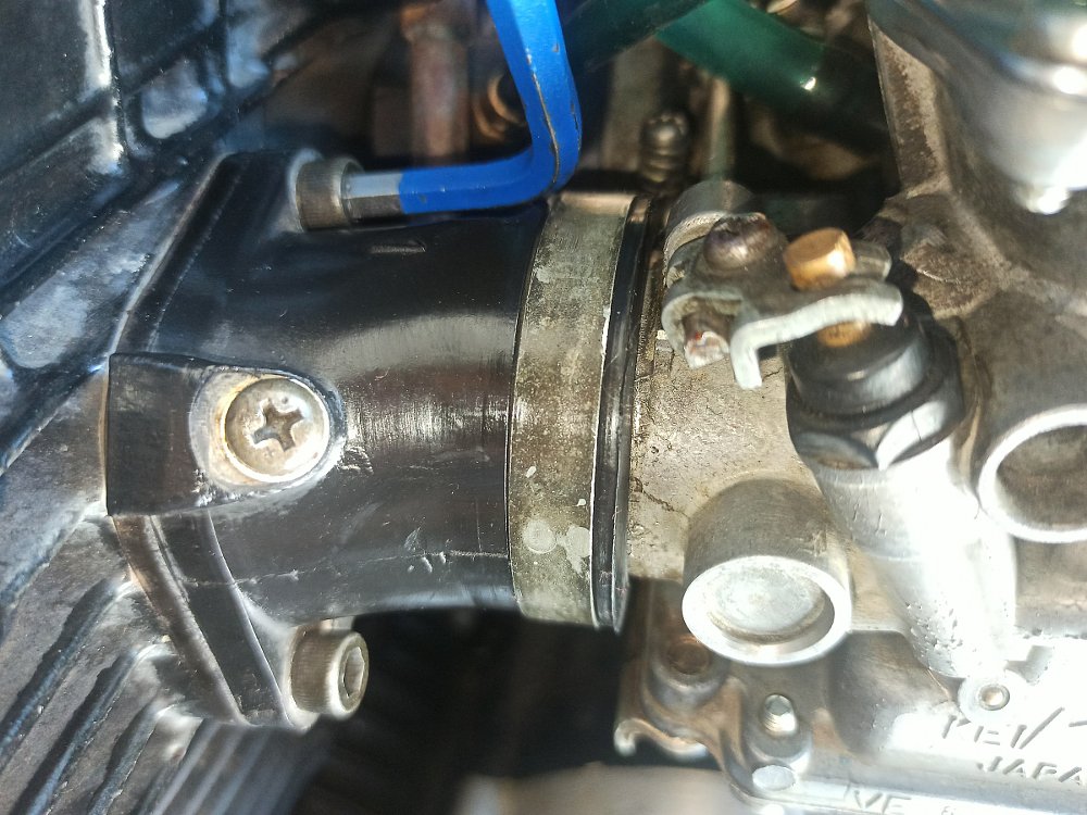 old carburetor on engine