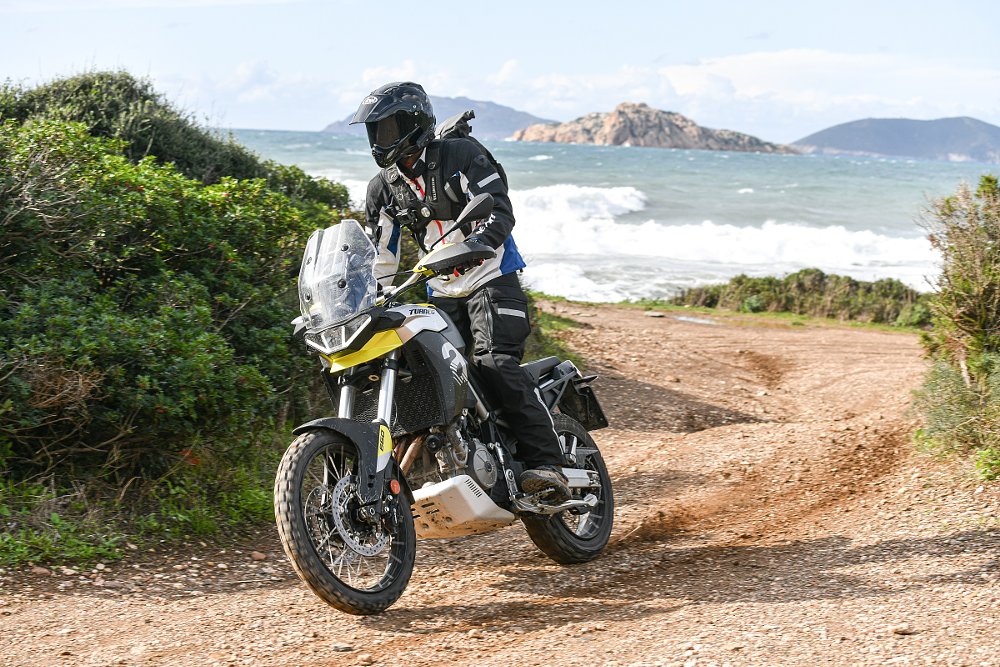 Aprilia Tuareg 660 on a trail near the ocean