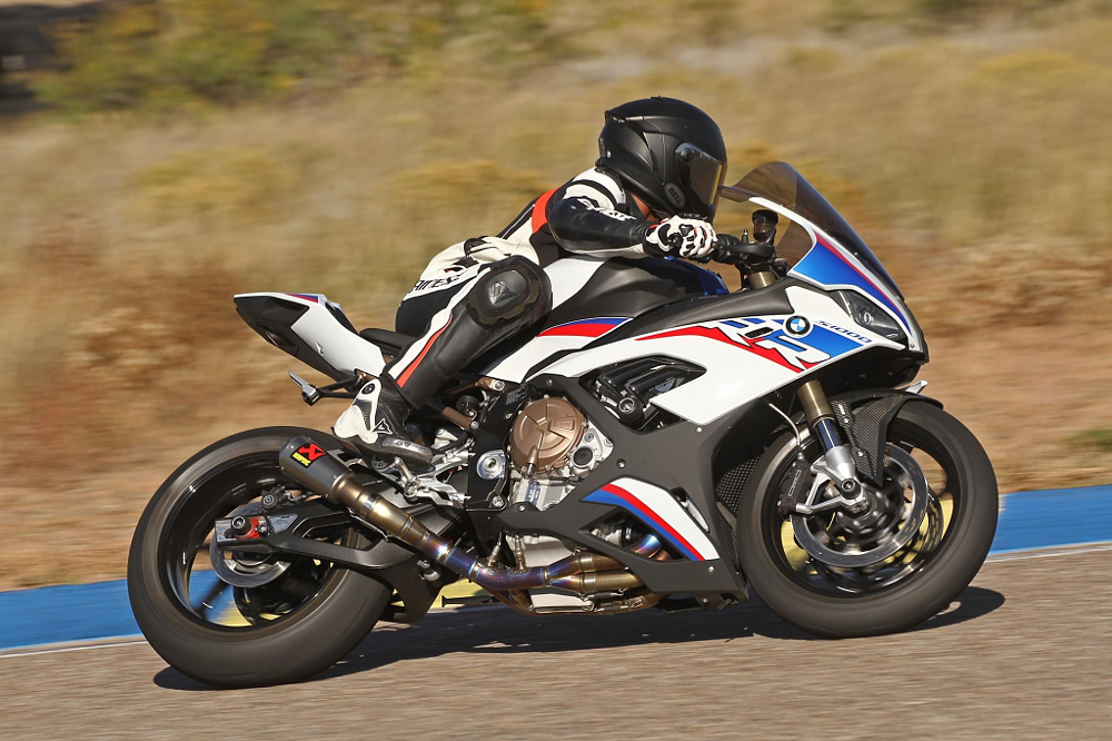 Fred rides on a race track on board his BMW s1000RR sportbike