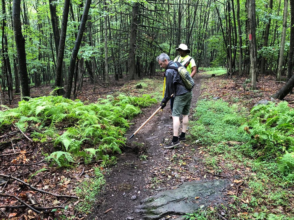 raking the berms on the trail