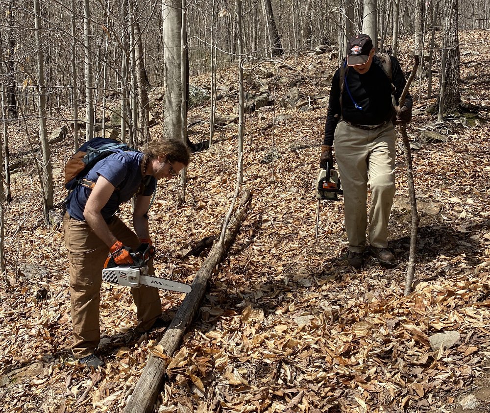 hiking the trail to mark the course