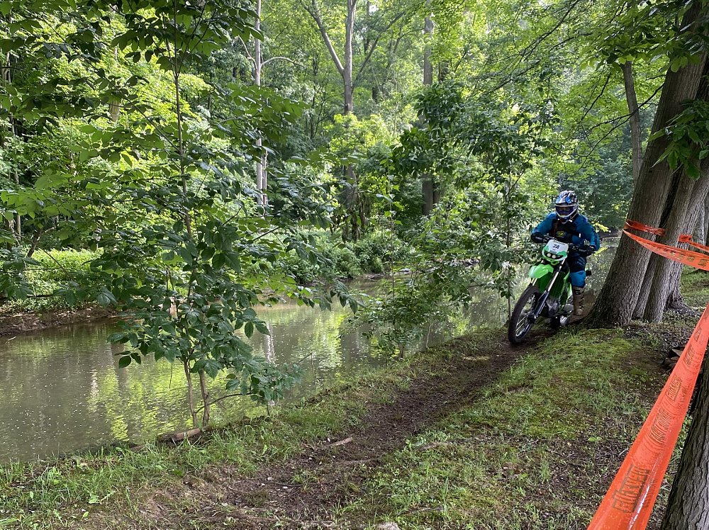 rider on the enduro course through the woods