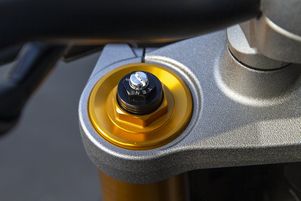 a close up of the adjustable KYB fork on the GSX-S1000
