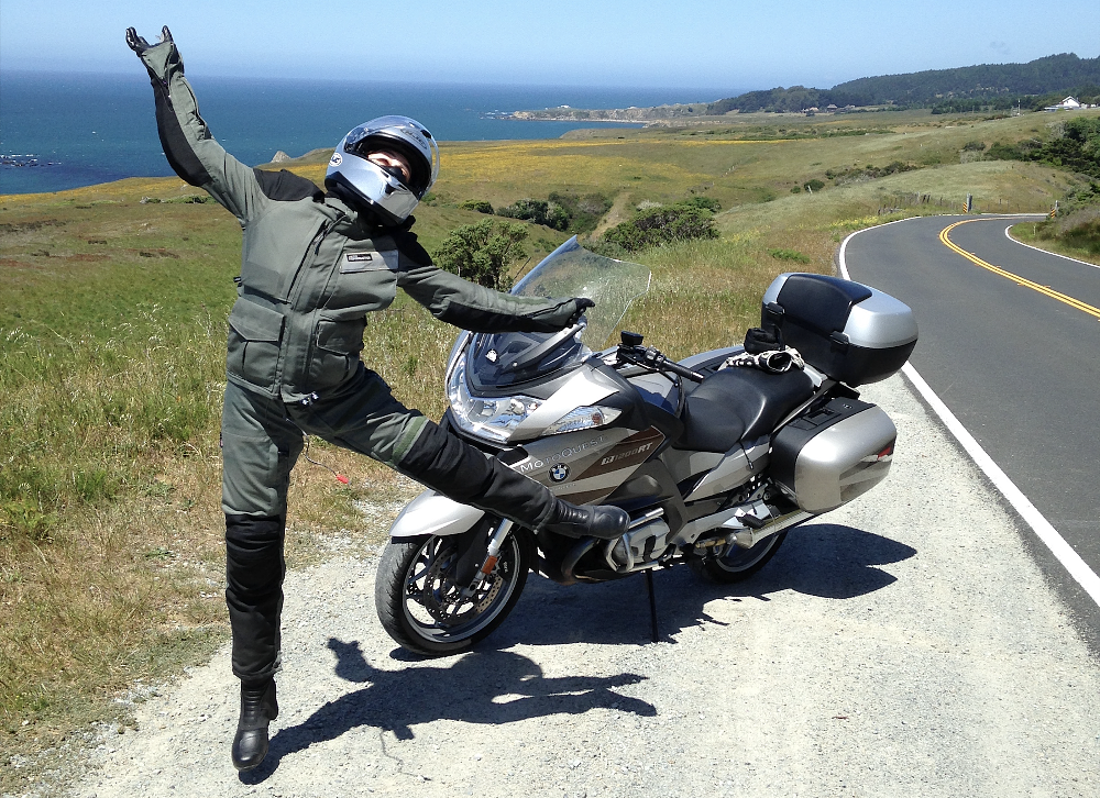 Loren Henning jumping for joy on the PCH. 