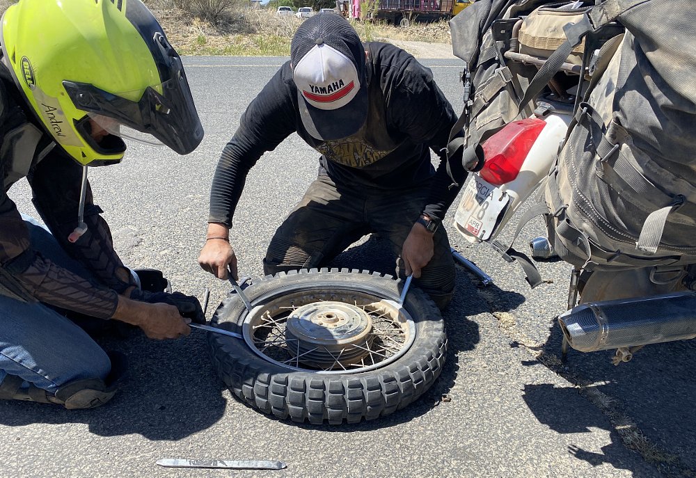 fixing a flat tire trailside