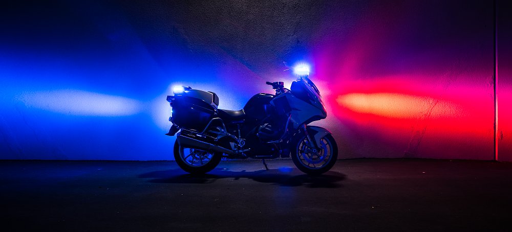2022 BMW R 1250 RT-Police with red and blue lights on at night.