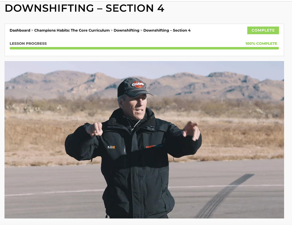 Screenshot of instructor showing how to downshift in video