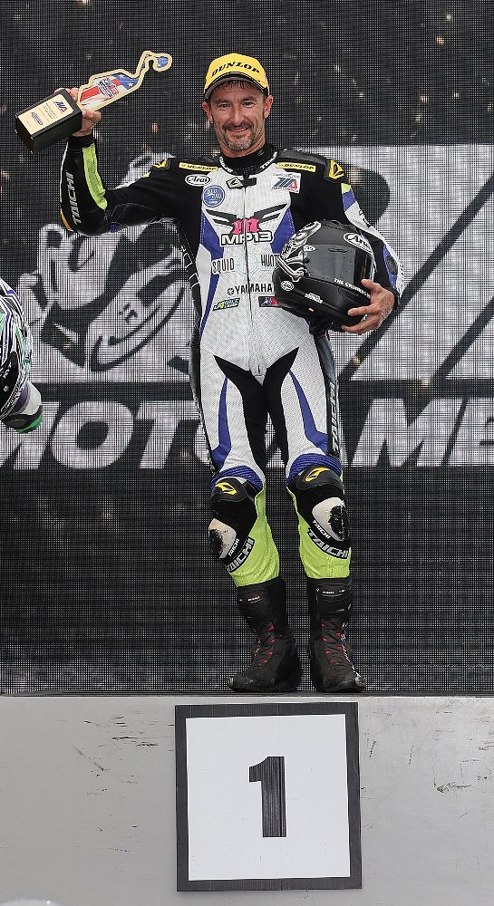 Josh Hayes on the top box in the post-race podium ceremony at NJMP