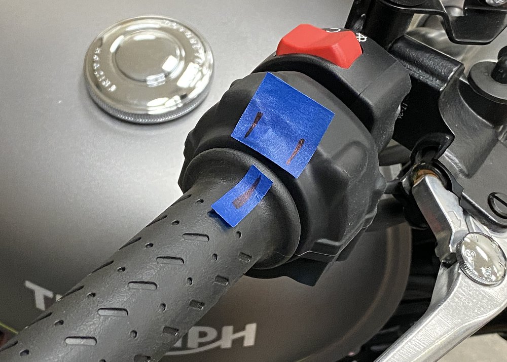 Checking motorcycle throttle freeplay.