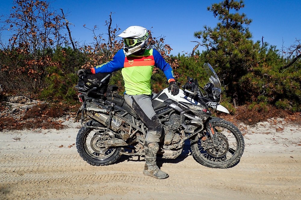 Spurgeon in dirt bike gear on his Triumph Tiger