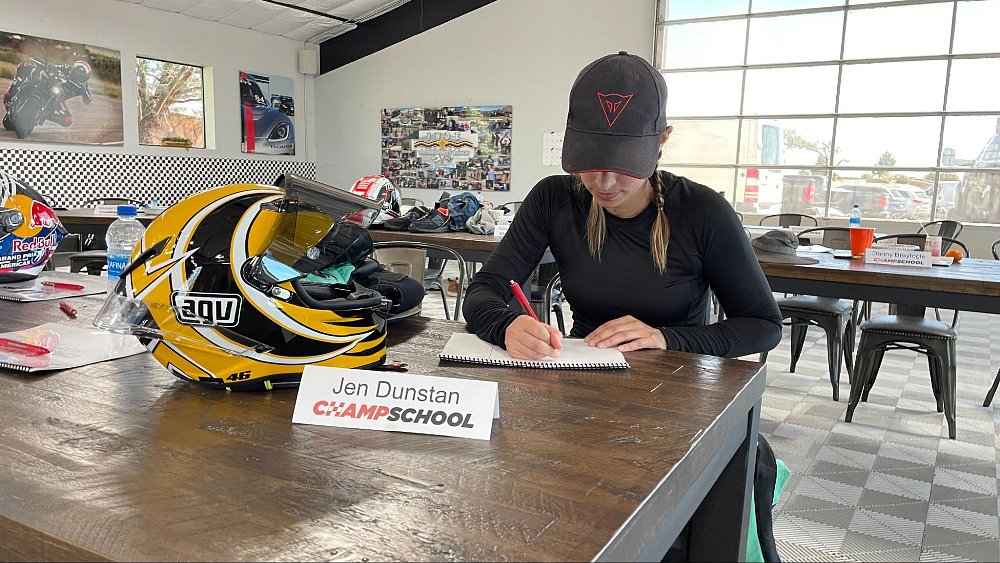 Jen Dunstan sitting in the classroom taking notes about the lesson
