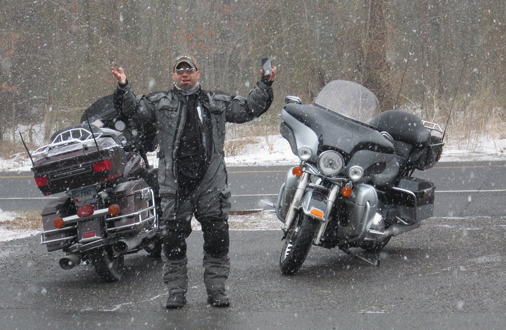 rider and motorcycle in snow flurry
