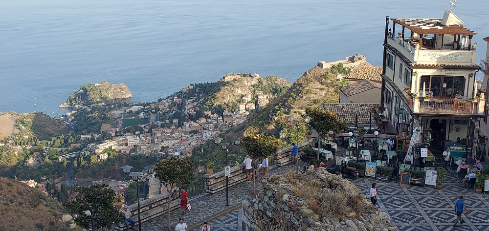 view from the town of Castelmola on a hillside above the ocean