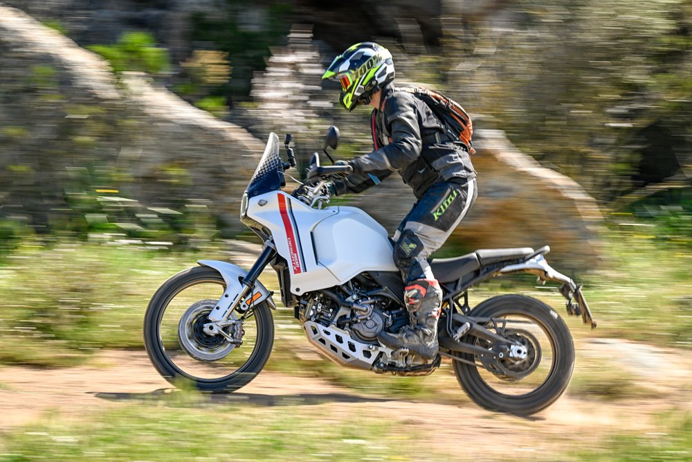 Spurgeon riding the Ducati DesertX on a dirt road