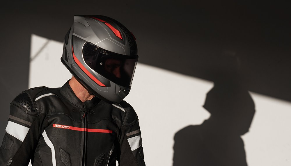 rider wearing a helmet at the track in the paddock