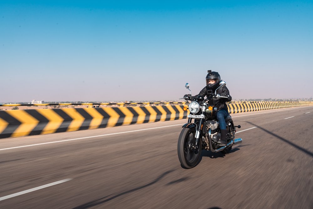 Female rider Jen pilots the Super Meteor on a big open freeway with dividers