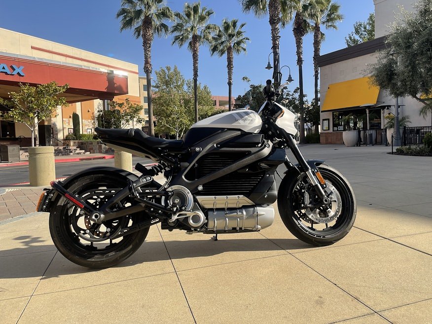 Livewire ONE electric naked sportbike parked in front of a movie theater