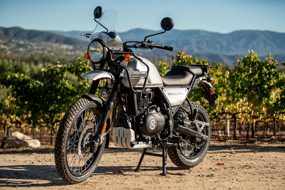Royal Enfield Himalayan parked by a vineyard