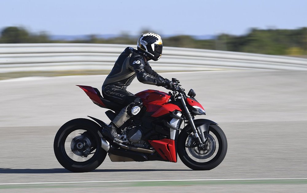 2022 Ducati Streetfighter V2 in profile, on a race track.
