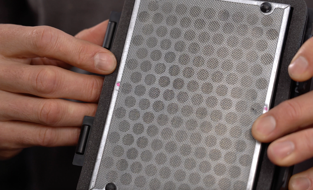 Backfire screen on a motorcycle air filter.