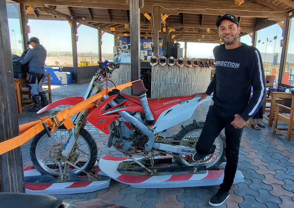 Hossan showing off his motorcycle made to ride on water