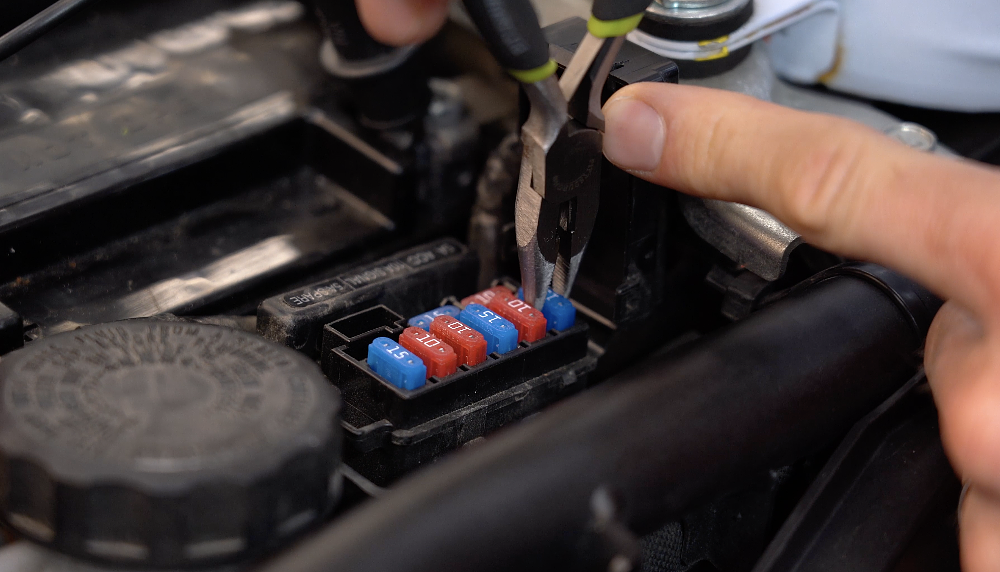 Removing fuel pump fuse from motorcycle