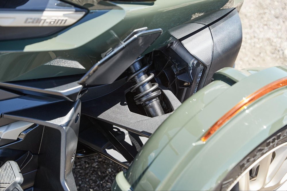 close up of the front suspension of the can-am three wheeler