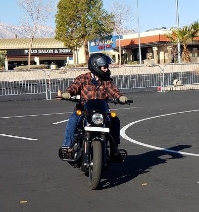 rider taking the MSF course in a parking lot