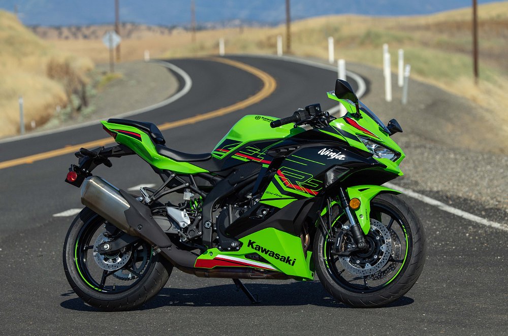 2023 Kawasaki ZX-4RR parked next to a winding road.