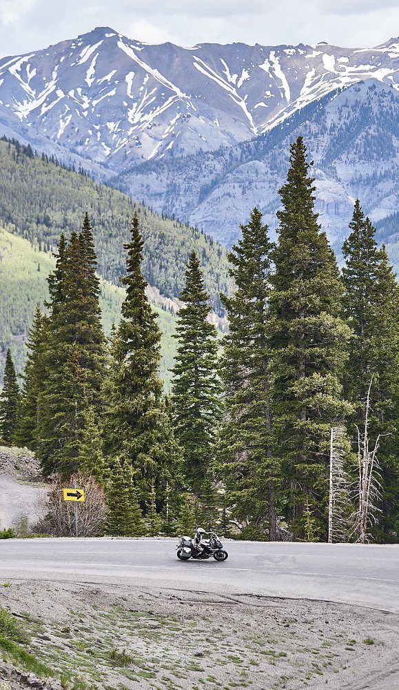 long view of the Multistrada V4 Rally on a mountain road