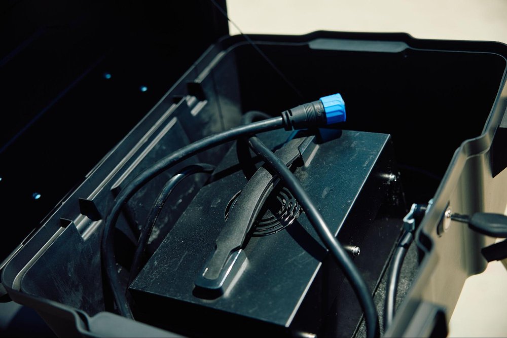 A photo of the RX1E charger packed into the top box pannier