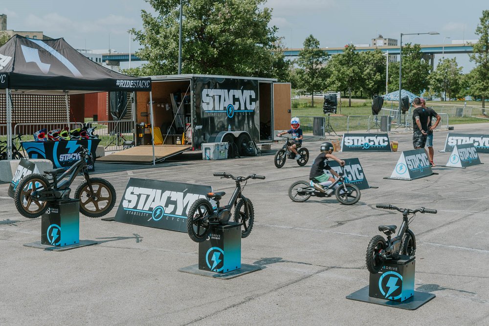 kids test riding Stacyc balance bikes