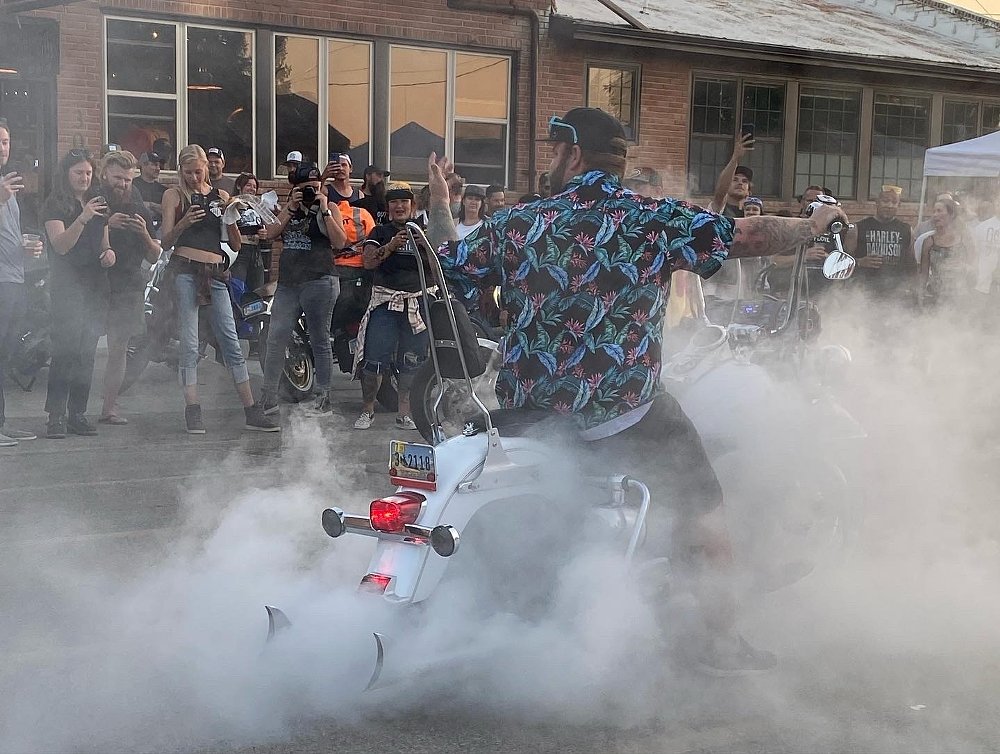 rider doing a burnout in front of the crowd