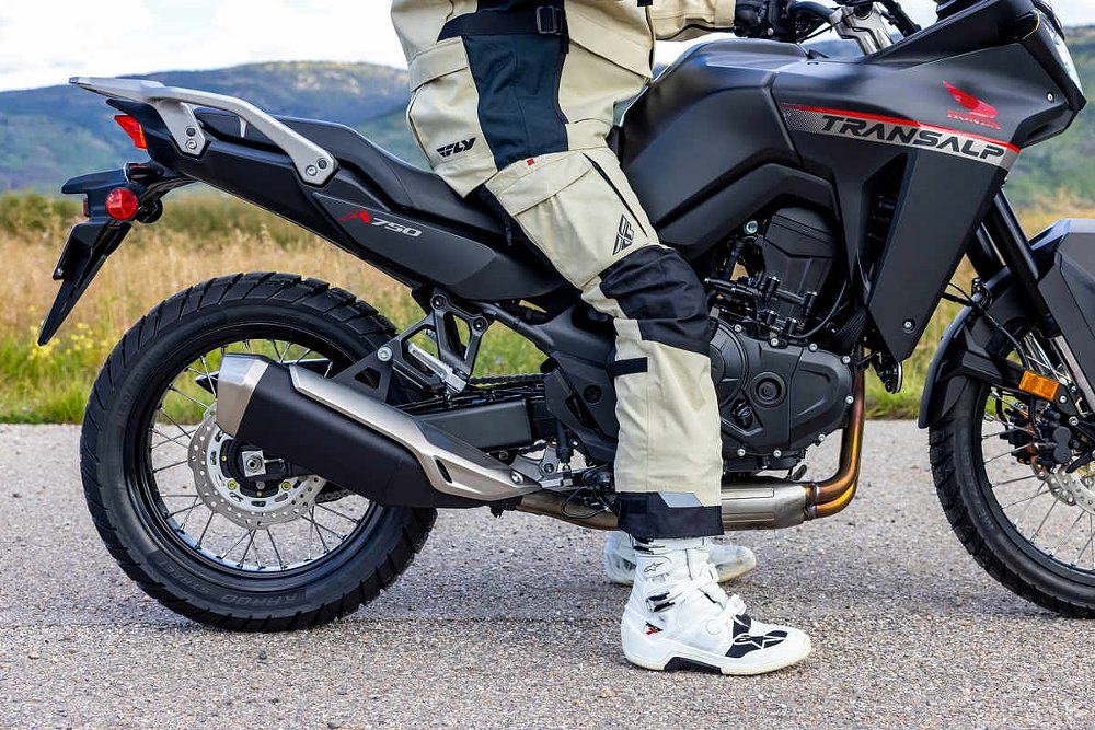 rider sitting on a Honda Transalp to show reach to the ground
