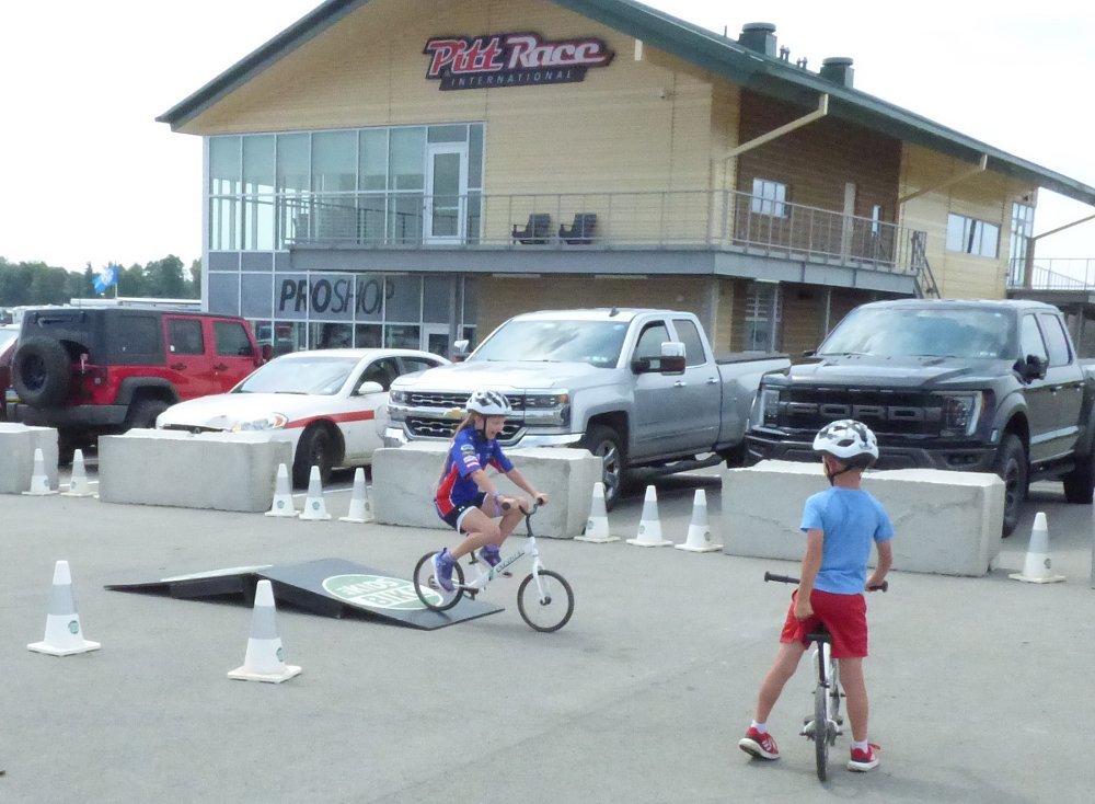kids riding in the paddock at PittRace