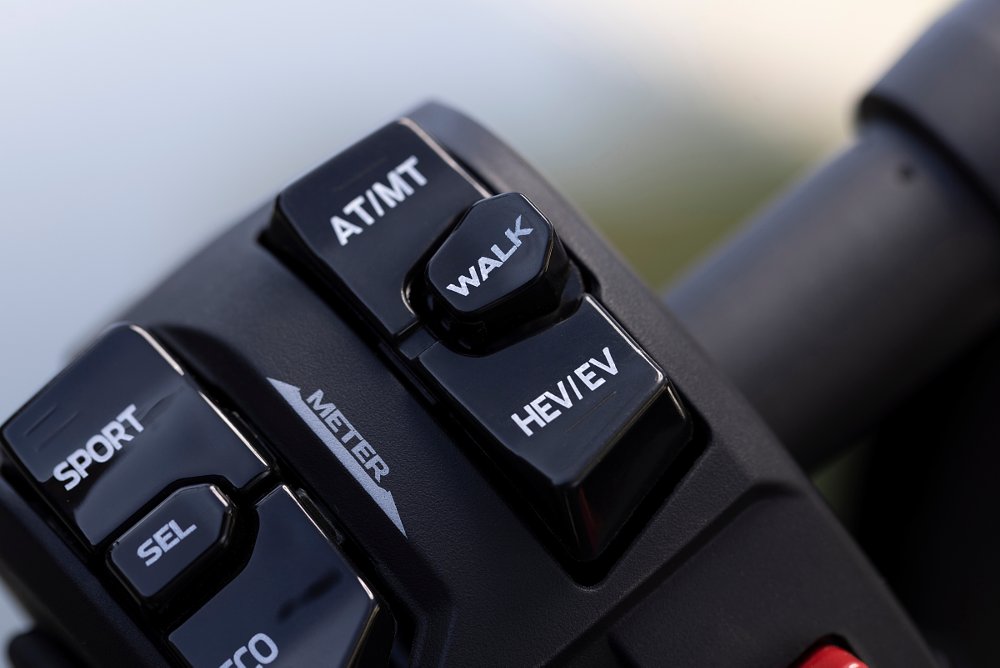 the button cluster on the left hand grip shows all the buttons for riding modes on ninja 7 hybrid