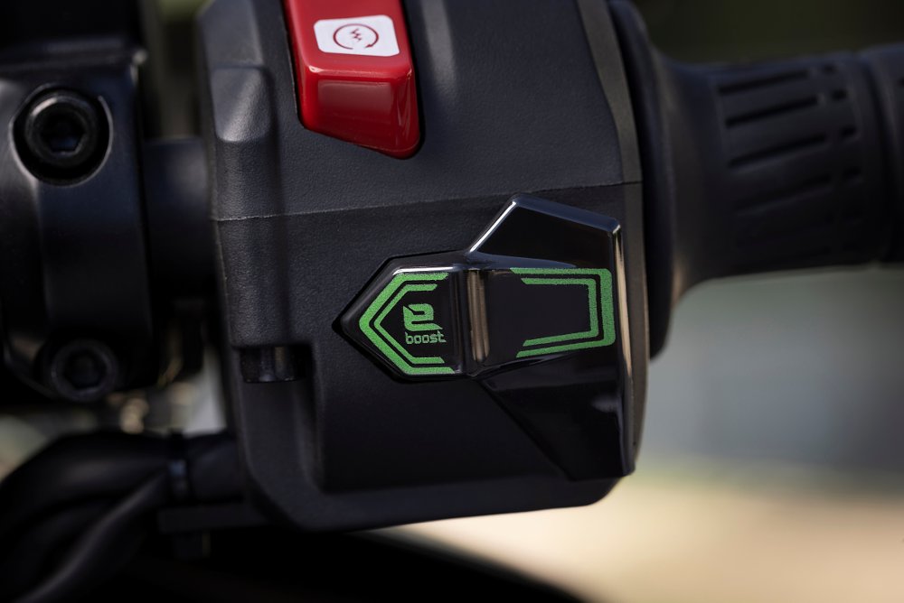 a close up view of the e-boost button on the righthand cluster near the handlebar grip