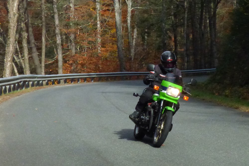 riding the Kawasaki KZ1000R on a back road under fall leaves