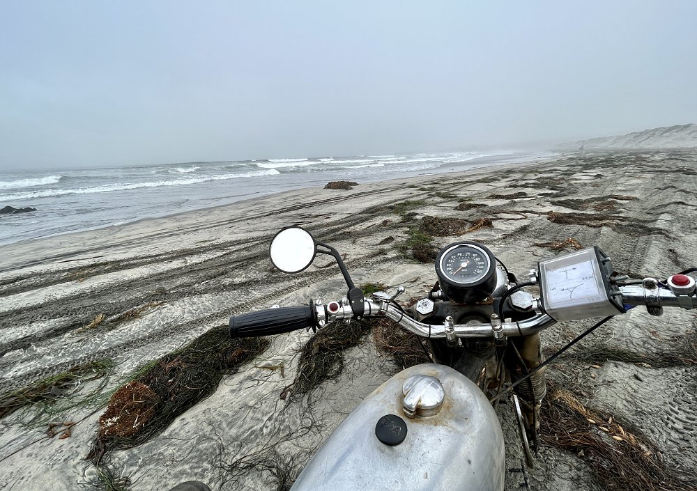 motorcycle on a foggy beach